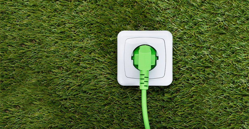 Green Plug In Outlet On Grass